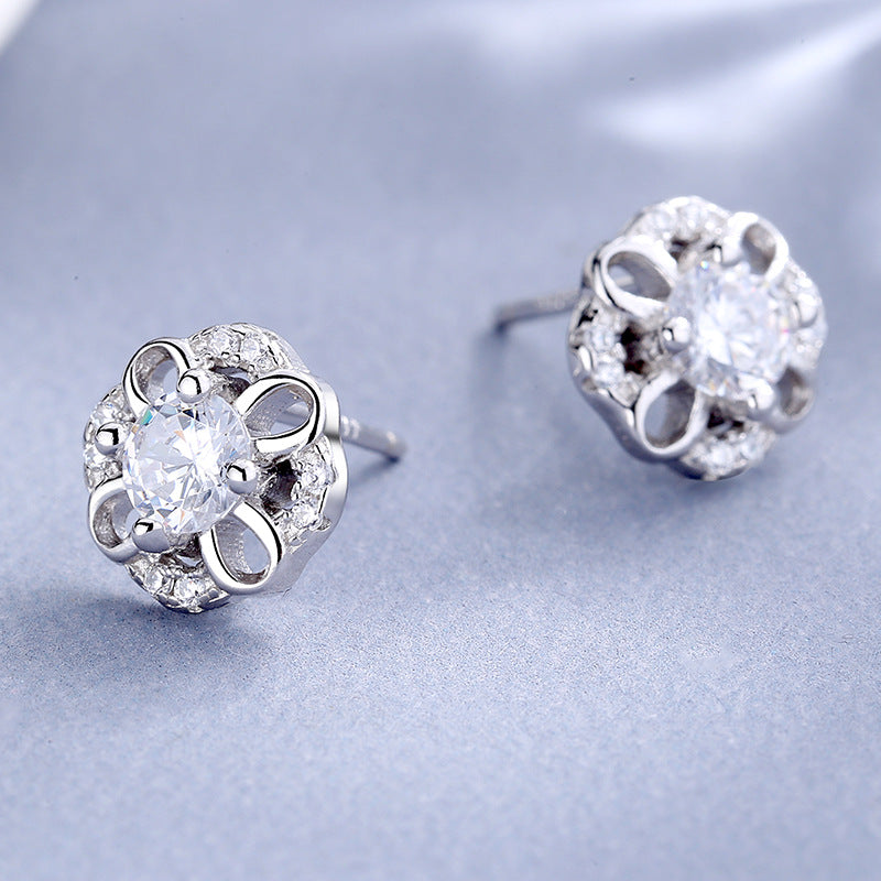 Women's stud earrings with delicate flower design and sparkling crystals Style and Serve
