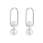 Women's stud earrings with modern oval design and elegant pearls Style and Serve