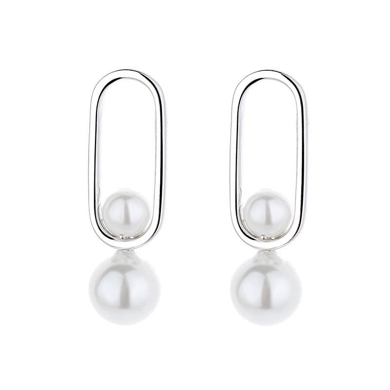 Women's stud earrings with modern oval design and elegant pearls Style and Serve