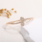 Women's bangle with elegant infinity pattern and sparkling zirconia Style and Serve