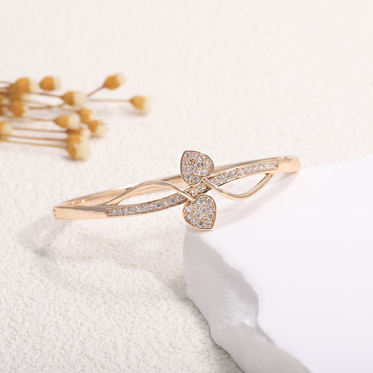 Women's bangle with elegant infinity pattern and sparkling zirconia Style and Serve