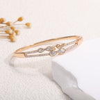 Women's bangle with elegant infinity pattern and sparkling zirconia Style and Serve