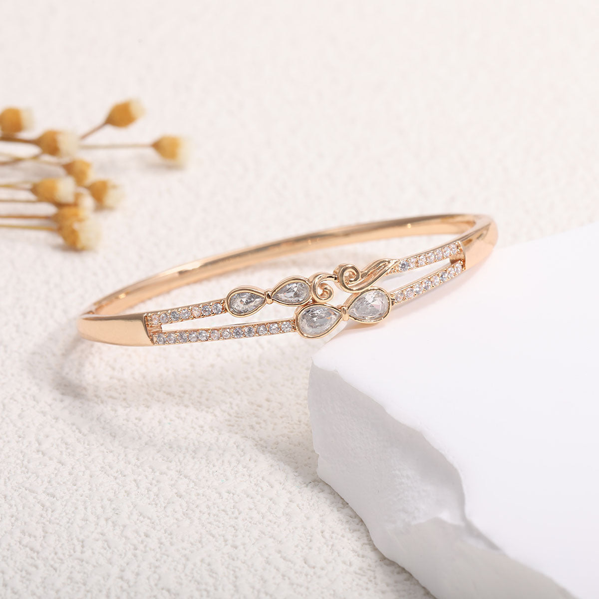 Women's bangle with elegant infinity pattern and sparkling zirconia Style and Serve