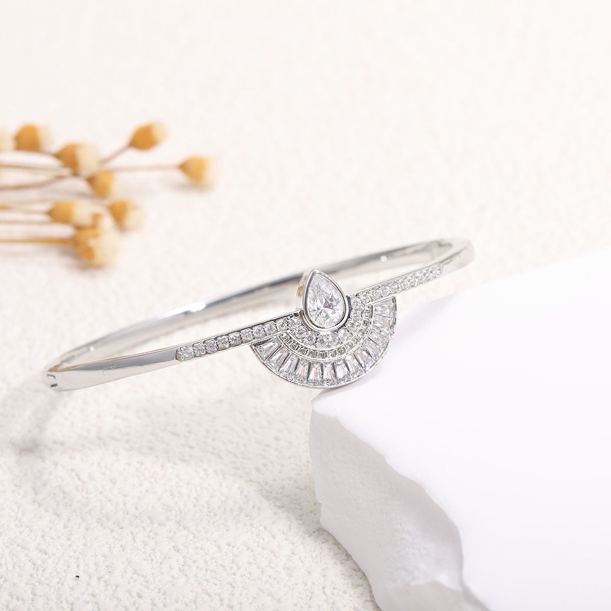 Women's bangle with elegant infinity pattern and sparkling zirconia Style and Serve