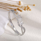 Women's bangle with elegant infinity pattern and sparkling zirconia Style and Serve