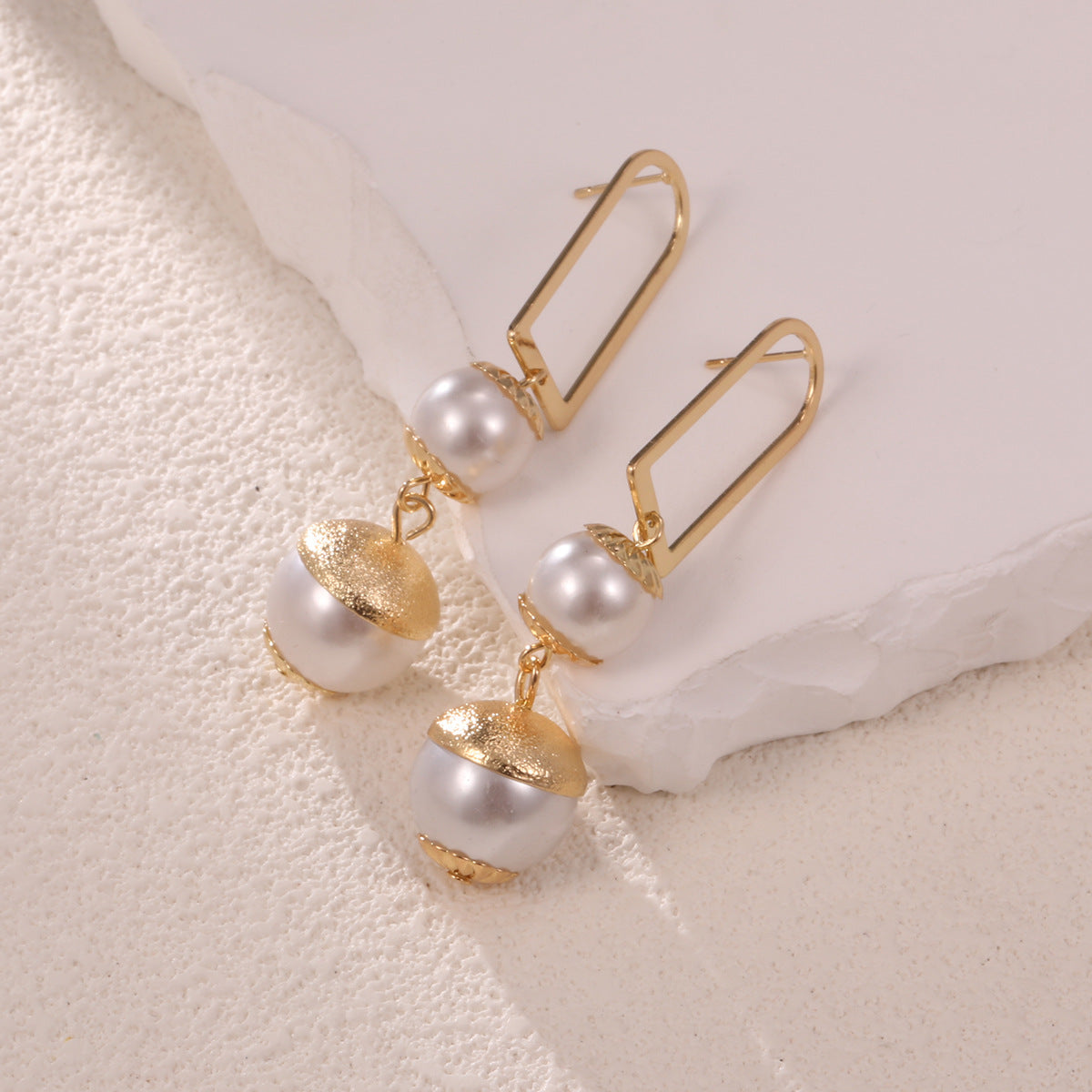 Ladies earrings with elegant pearl design Style and Serve