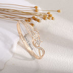 Women's bangle with elegant infinity pattern and sparkling zirconia Style and Serve