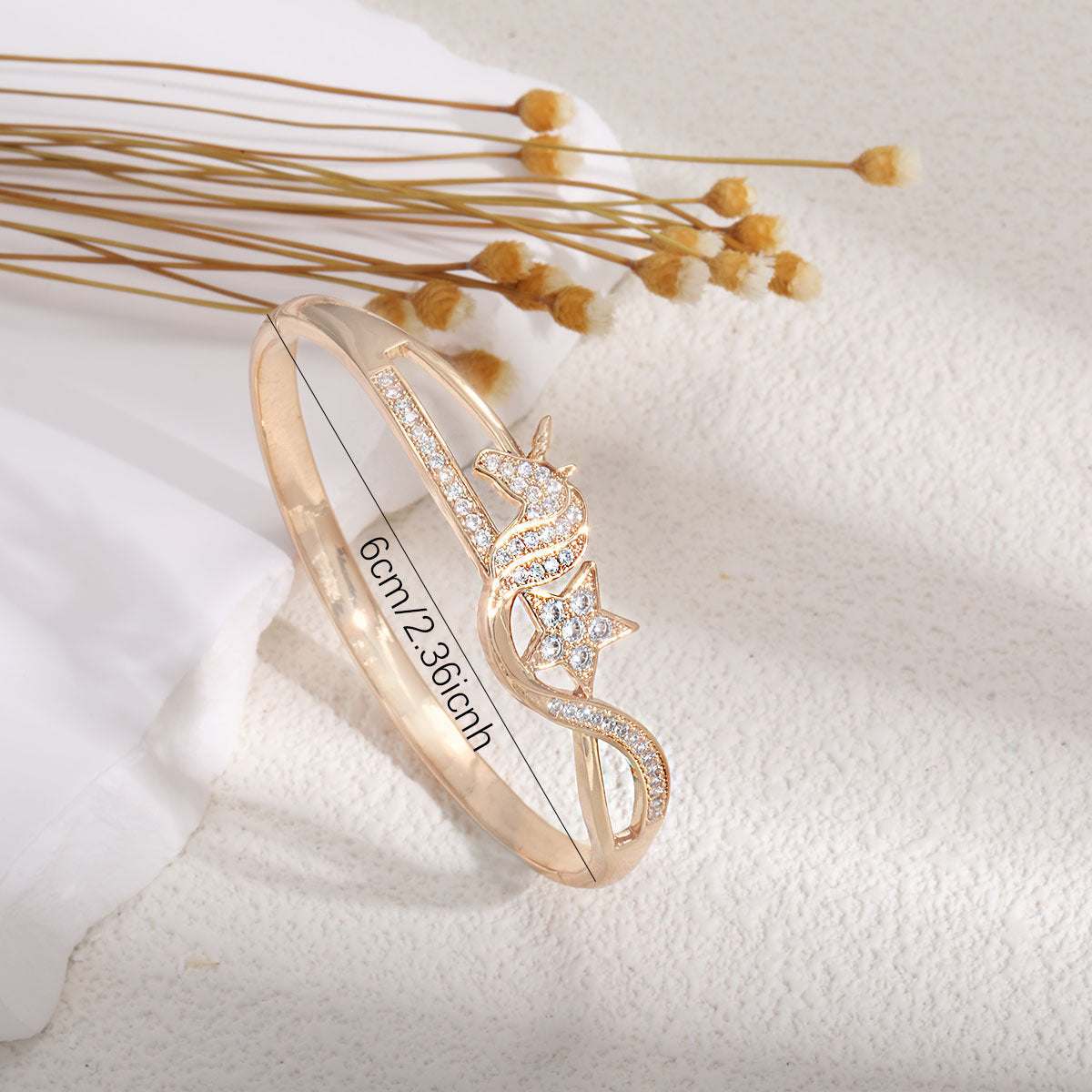 Women's bangle with elegant infinity pattern and sparkling zirconia Style and Serve