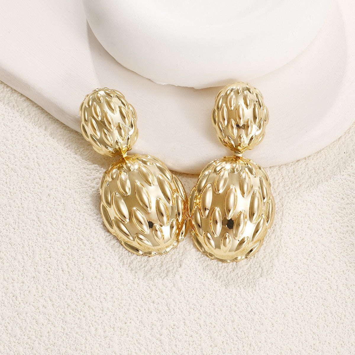 Women's earrings in artistic, structured design Style and Serve