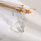 Women's bangle with elegant infinity pattern and sparkling zirconia Style and Serve