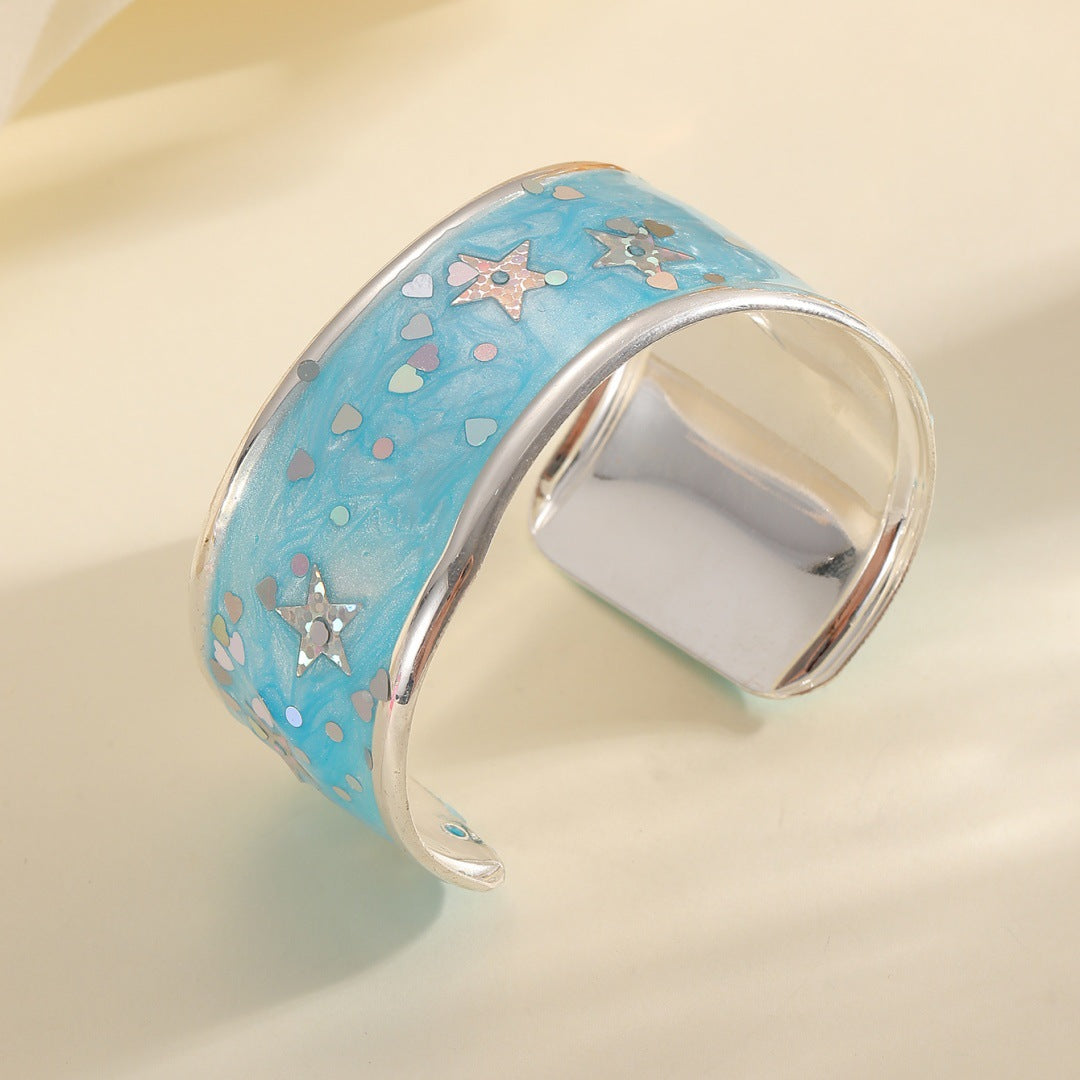 Women's bangle with sparkling star motif Style and Serve