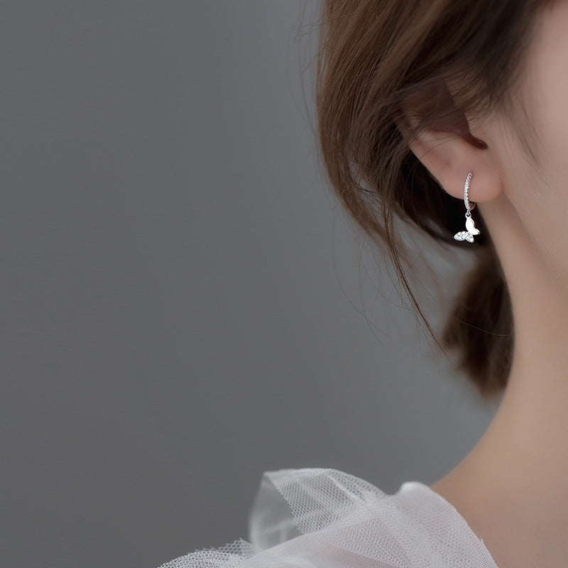 Ladies earrings with elegant butterfly design and sparkling details Style and Serve