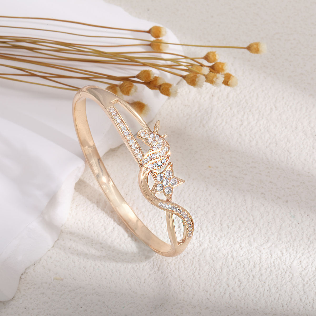 Women's bangle with elegant infinity pattern and sparkling zirconia Style and Serve