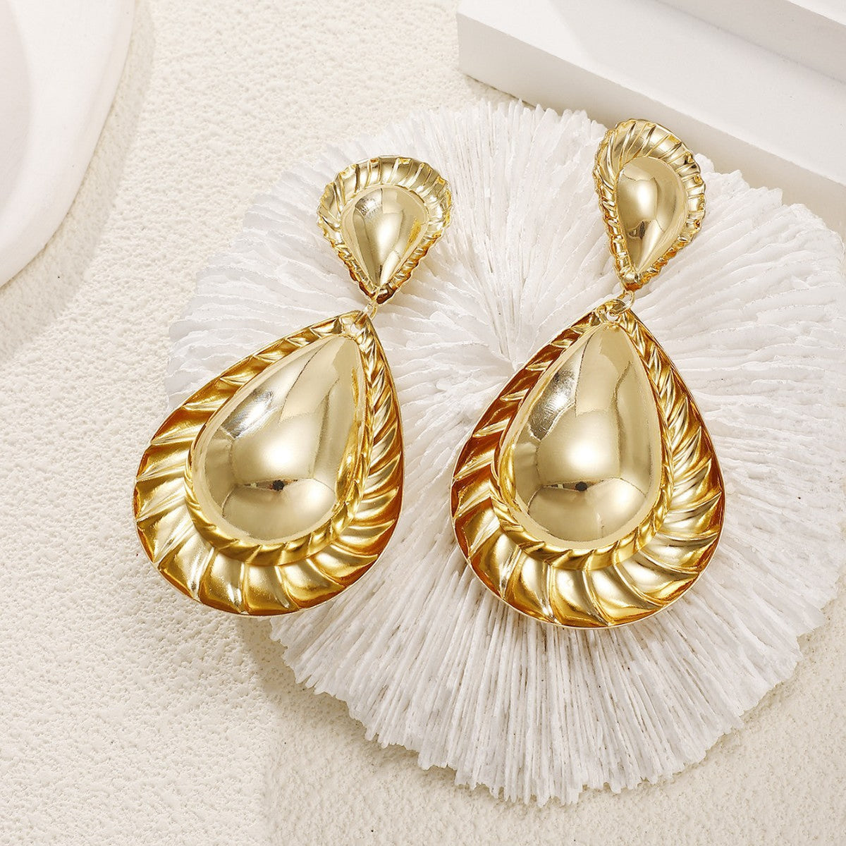 Women's earrings in artistic, structured design Style and Serve