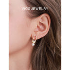 Women's stud earrings with modern oval design and elegant pearls Style and Serve