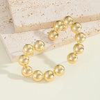Women's bracelet with structured, golden beads Style and Serve