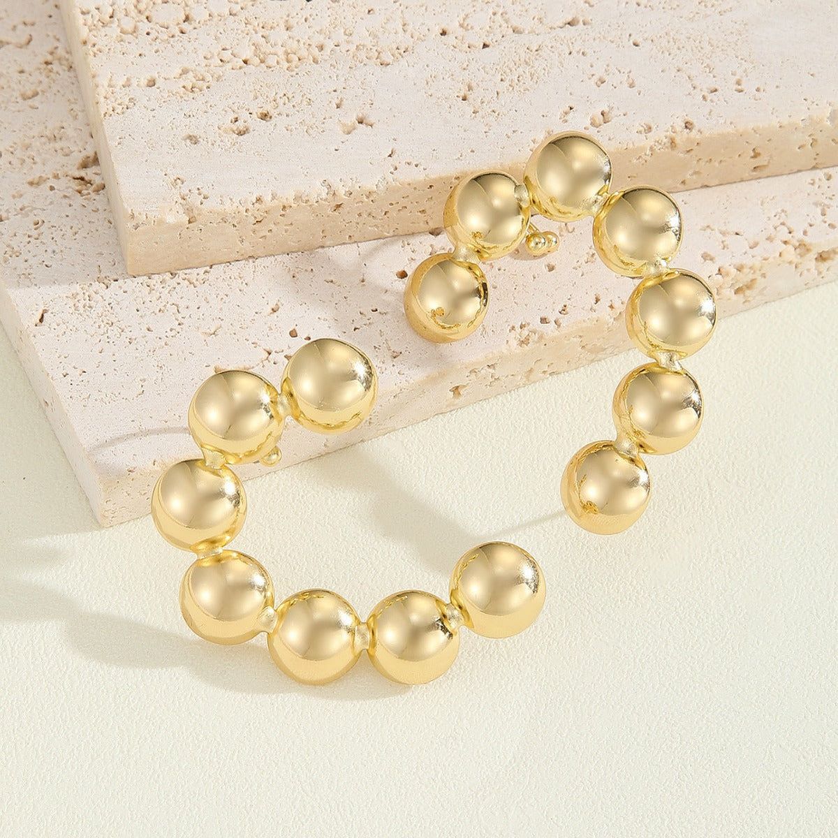 Women's bracelet with structured, golden beads Style and Serve