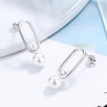 Women's stud earrings with modern oval design and elegant pearls Style and Serve