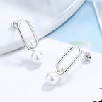 Women's stud earrings with modern oval design and elegant pearls Style and Serve