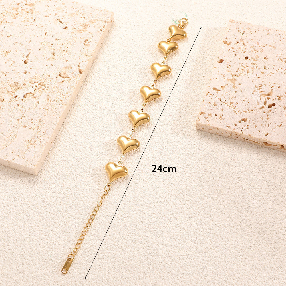 Ladies' bracelet with elegant heart design and fine link chain Style and Serve