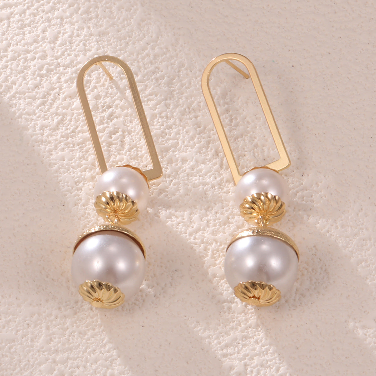 Ladies earrings with elegant pearl design Style and Serve