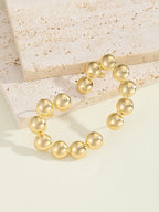 Women's bracelet with structured, golden beads Style and Serve