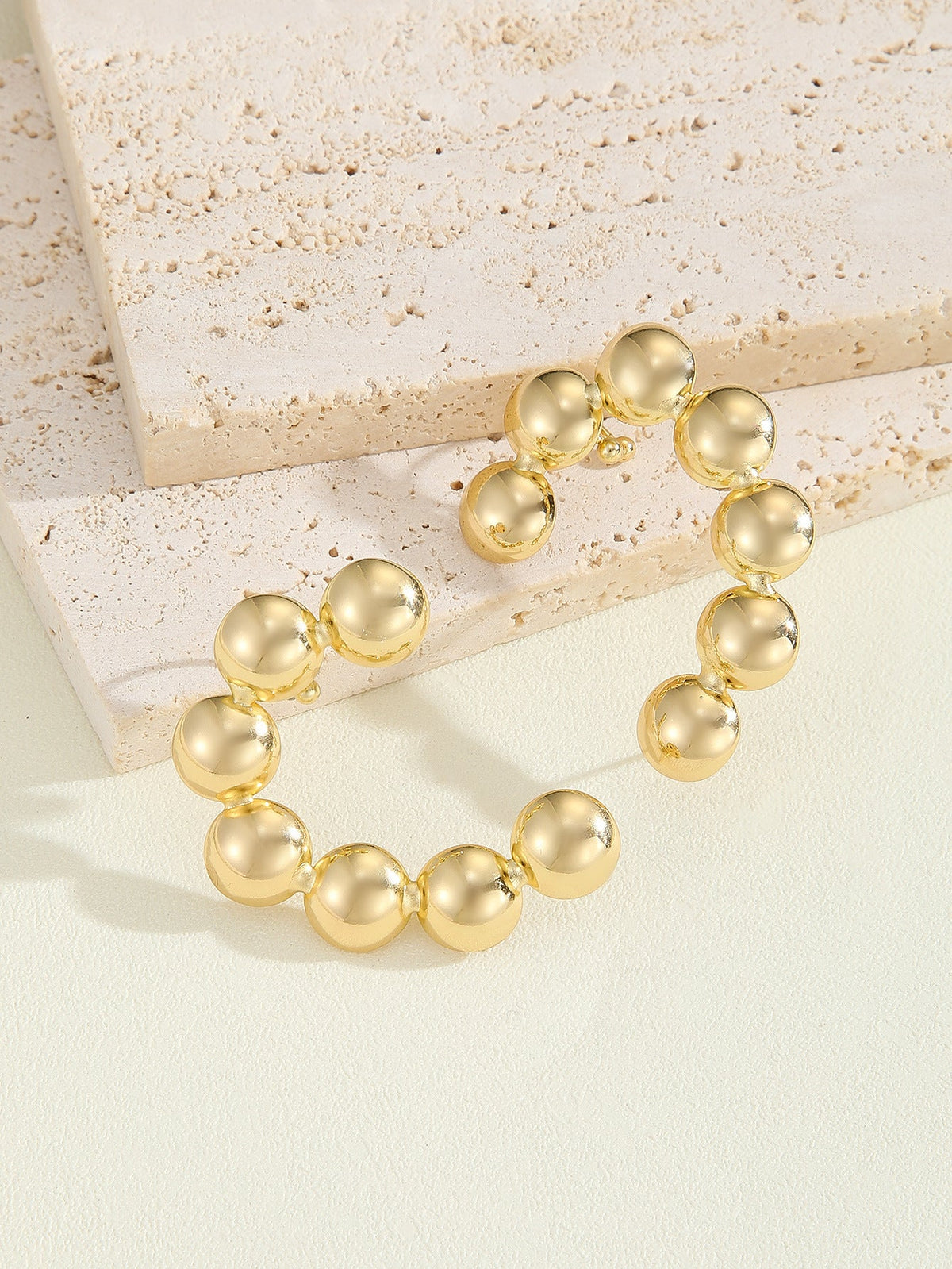 Women's bracelet with structured, golden beads Style and Serve