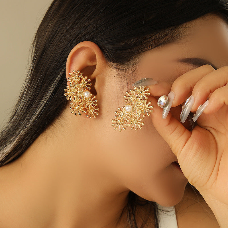 Women’s ear clips with elaborate flower design and pearl accent Style and Serve