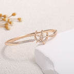 Women's bangle with elegant infinity pattern and sparkling zirconia Style and Serve
