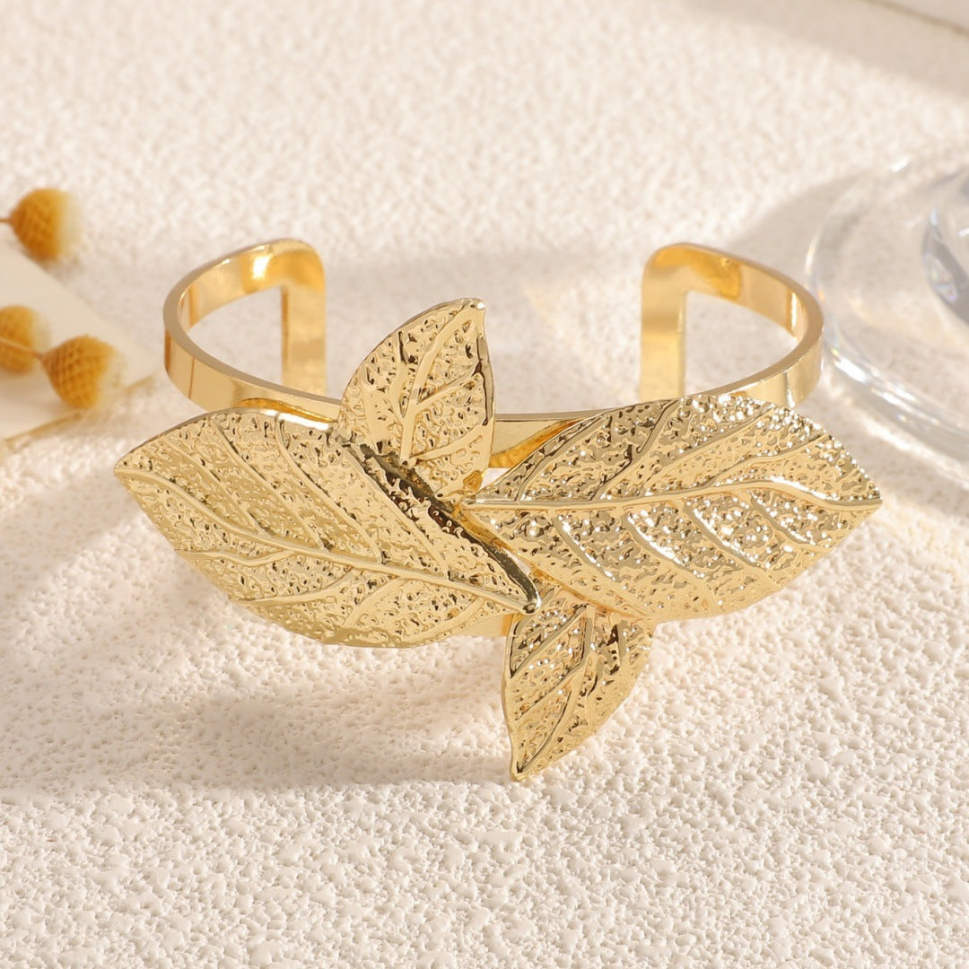 Ladies' bangle with artistic leaf design Style and Serve