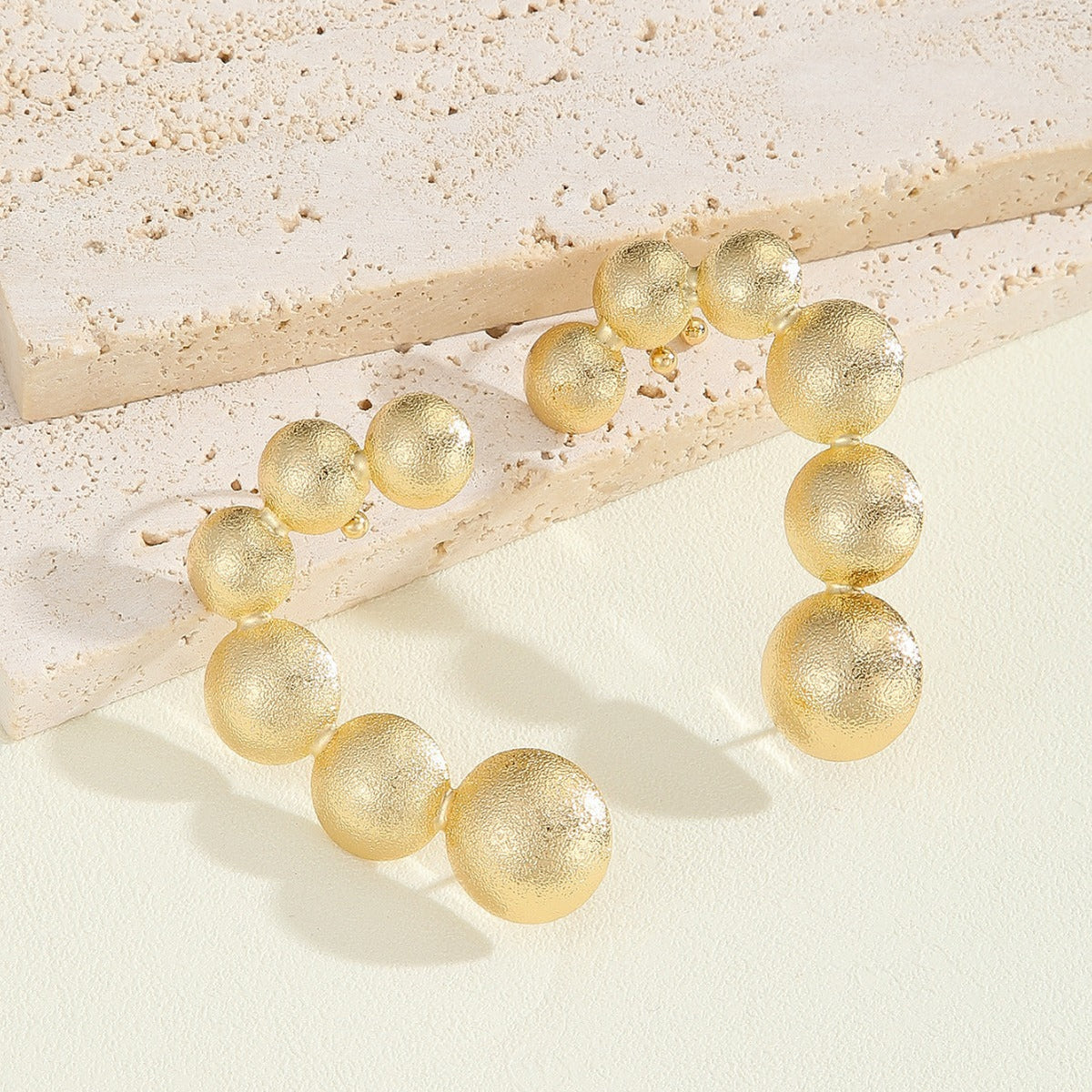 Women's bracelet with structured, golden beads Style and Serve