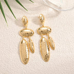 Women Hanging Earrings with artistic, three-dimensional design Style and Serve