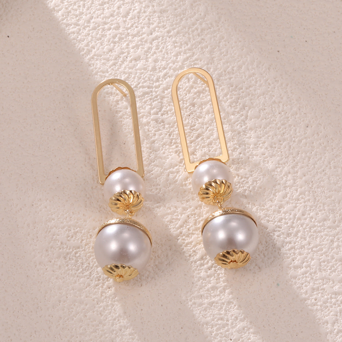 Ladies earrings with elegant pearl design Style and Serve