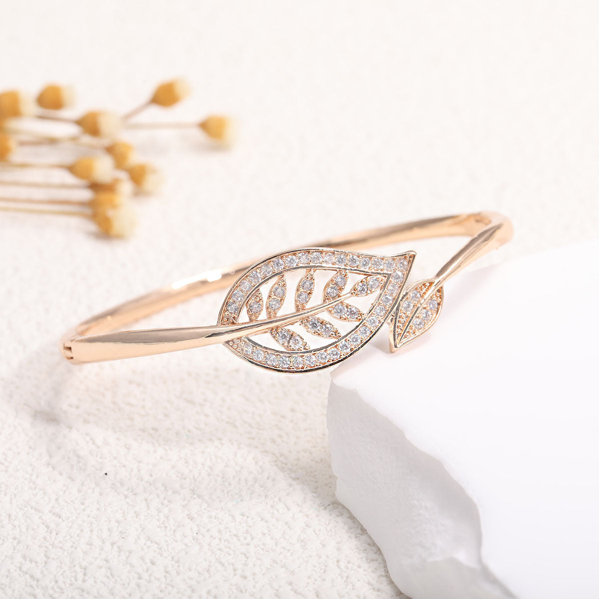 Women's bangle with elegant infinity pattern and sparkling zirconia Style and Serve