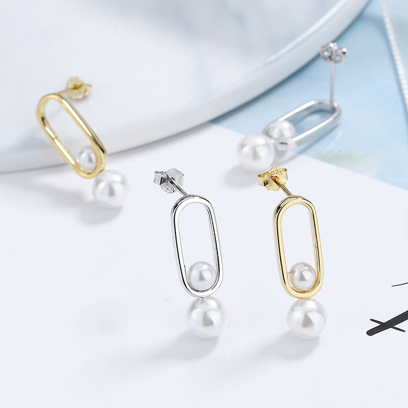Women's stud earrings with modern oval design and elegant pearls Style and Serve