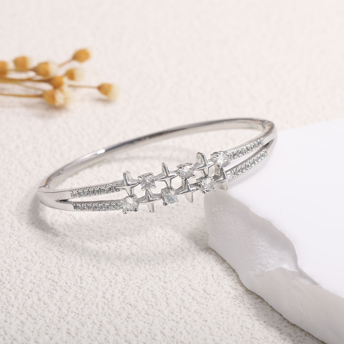 Women's bangle with elegant infinity pattern and sparkling zirconia Style and Serve