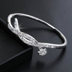 Women's bangle with elegant infinity pattern and sparkling zirconia Style and Serve